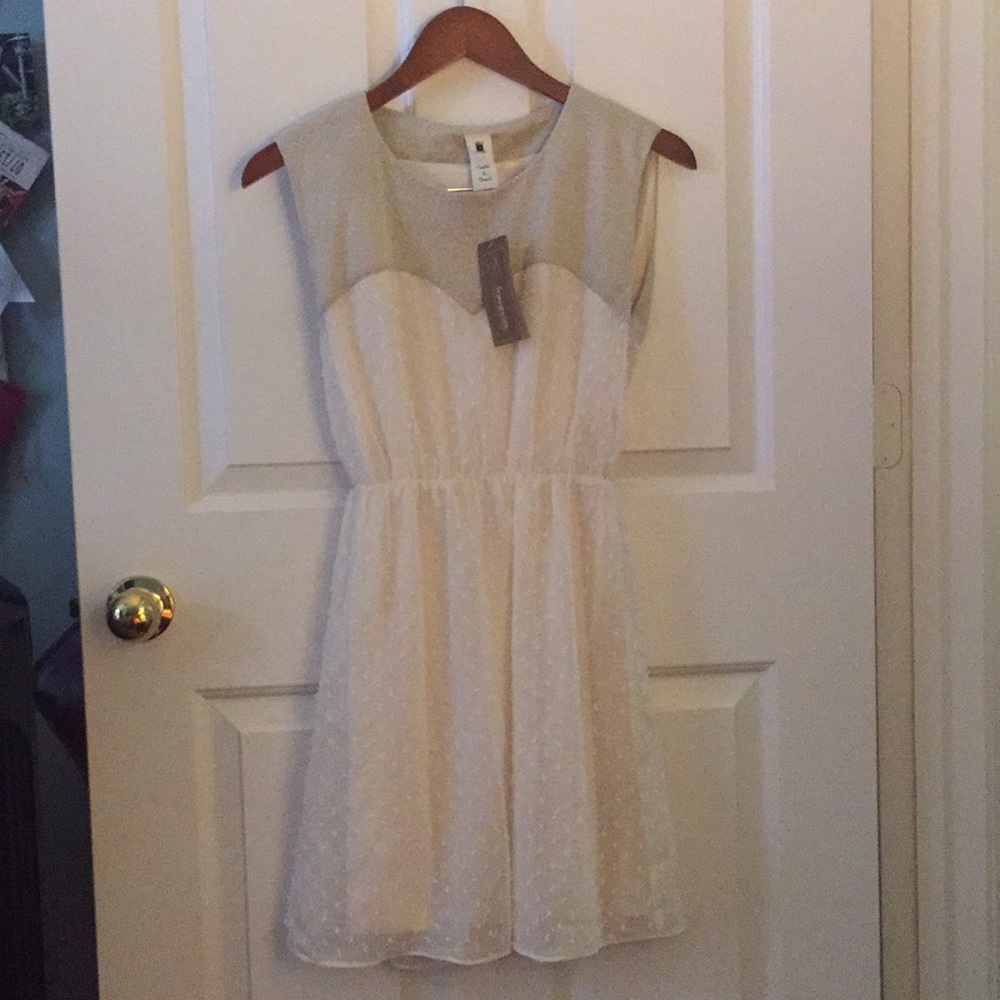 Francesca’s cream colored dress